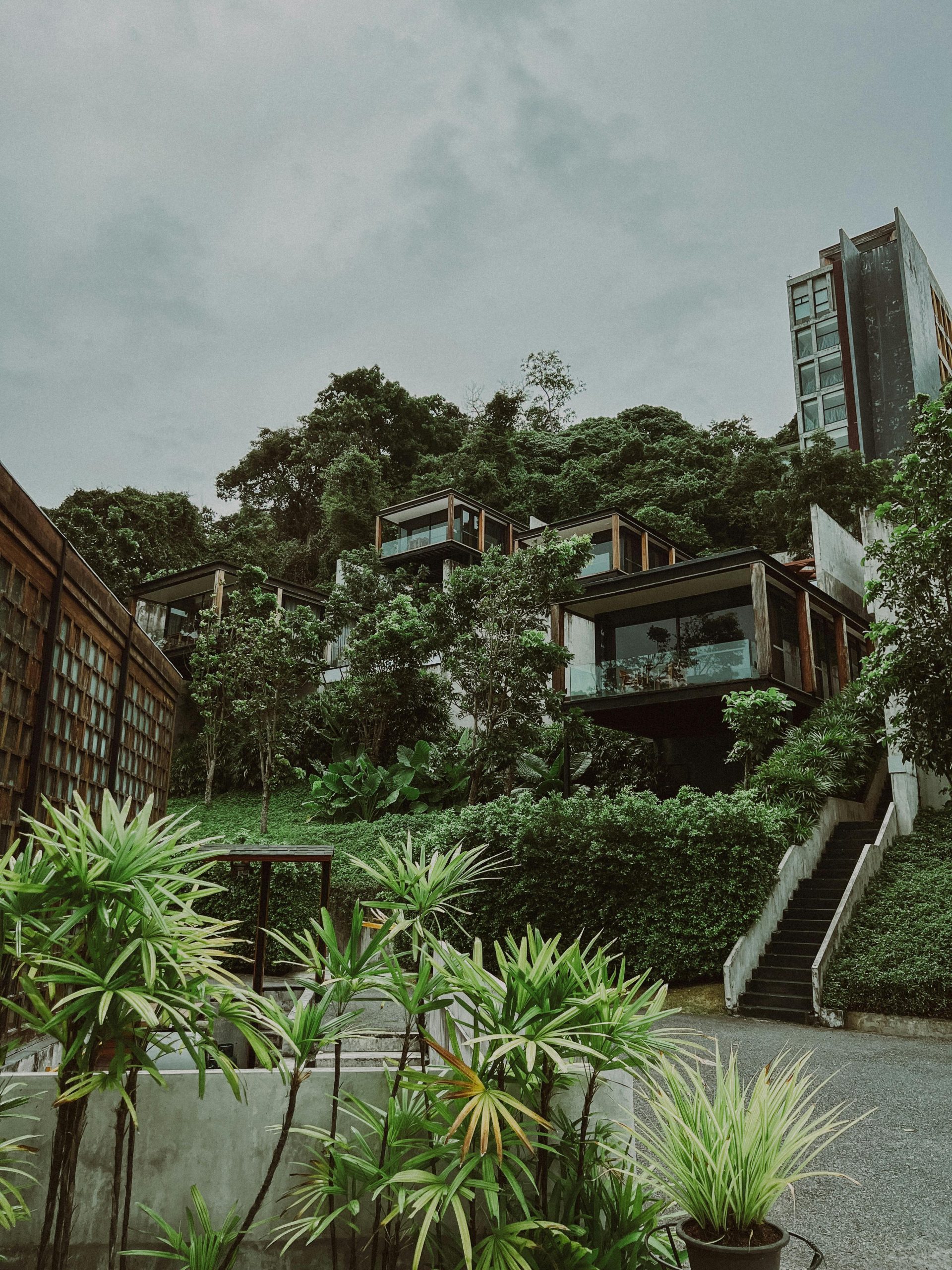 Lush tropical resort nestled on a hillside in Kamala, Phuket, Thailand.