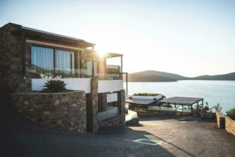 Elegant modern house by the lake with stunning sunrise view. Ideal real estate.